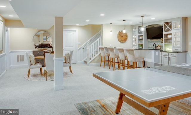 playroom featuring light colored carpet and sink