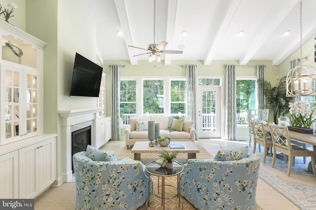 living room featuring beam ceiling, ceiling fan, and light hardwood / wood-style flooring