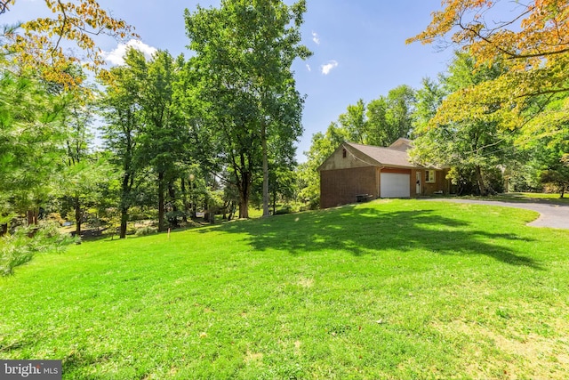 view of yard featuring a garage