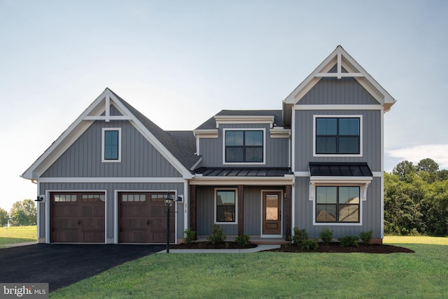 view of front of property featuring a garage and a front yard