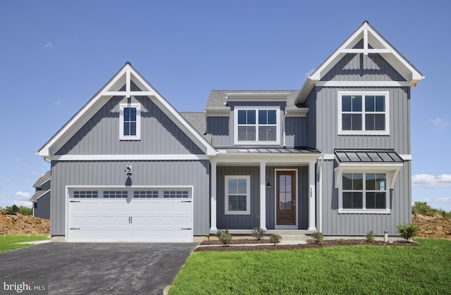 view of front facade featuring a front yard and a garage