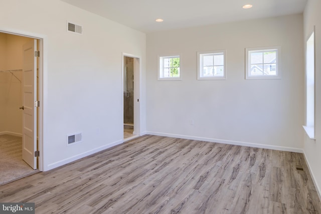 spare room with light hardwood / wood-style floors