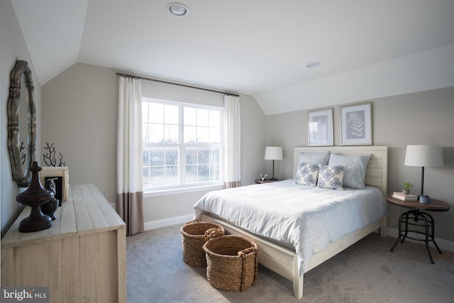 bedroom with lofted ceiling and carpet