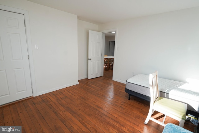 unfurnished room featuring dark hardwood / wood-style flooring