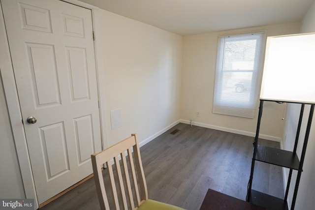 unfurnished dining area featuring dark hardwood / wood-style flooring