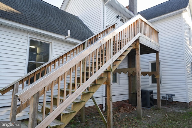 wooden terrace featuring central air condition unit