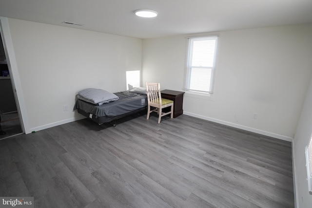 bedroom featuring dark wood-type flooring