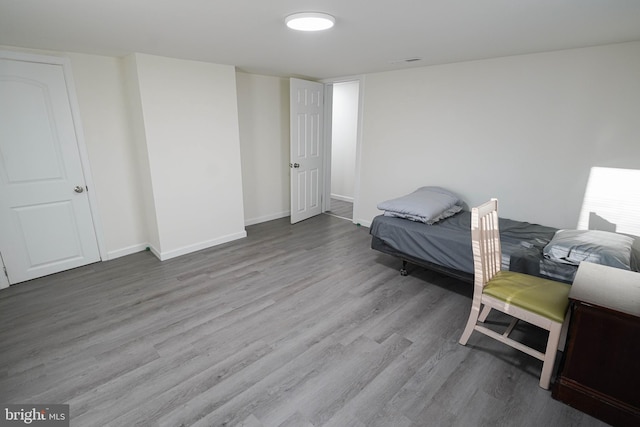 bedroom featuring hardwood / wood-style flooring