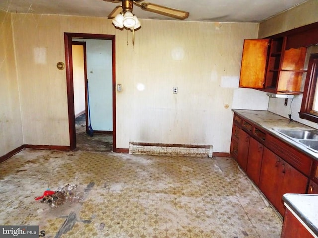 kitchen with ceiling fan and sink