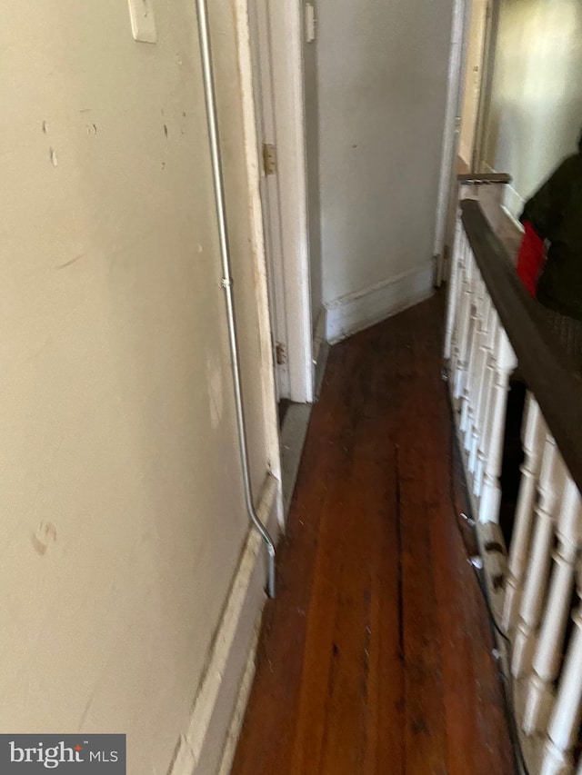 hallway featuring dark wood-type flooring