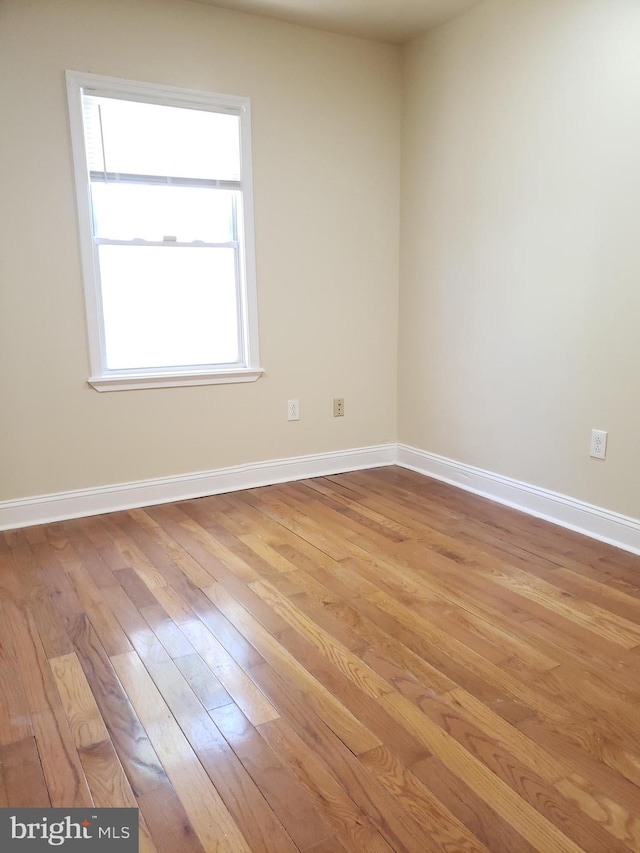 spare room with light wood-type flooring