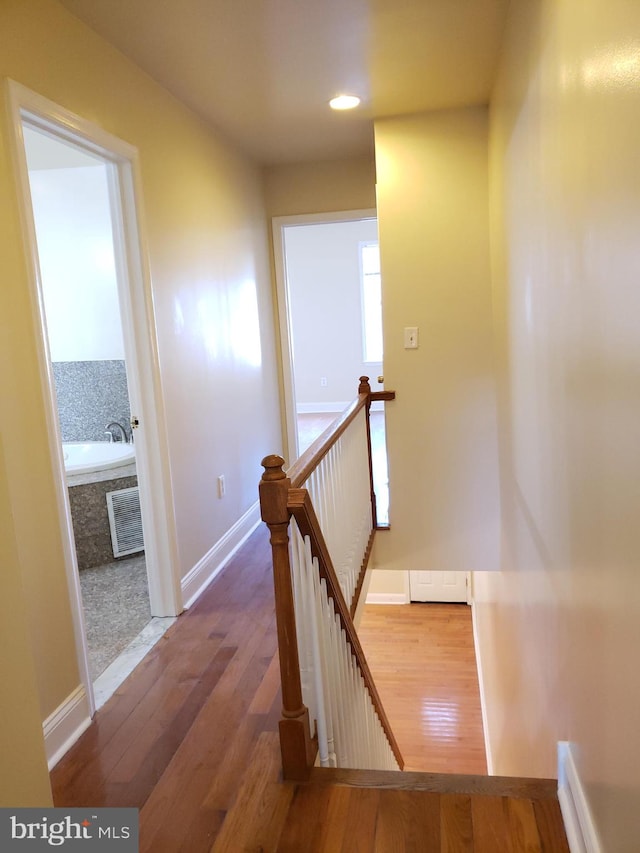 stairway with wood-type flooring