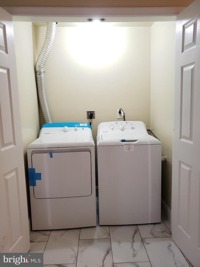 2615 N 12th St, Philadelphia, PA 19133 - washroom featuring washing machine and clothes dryer, laundry area, and marble finish floor