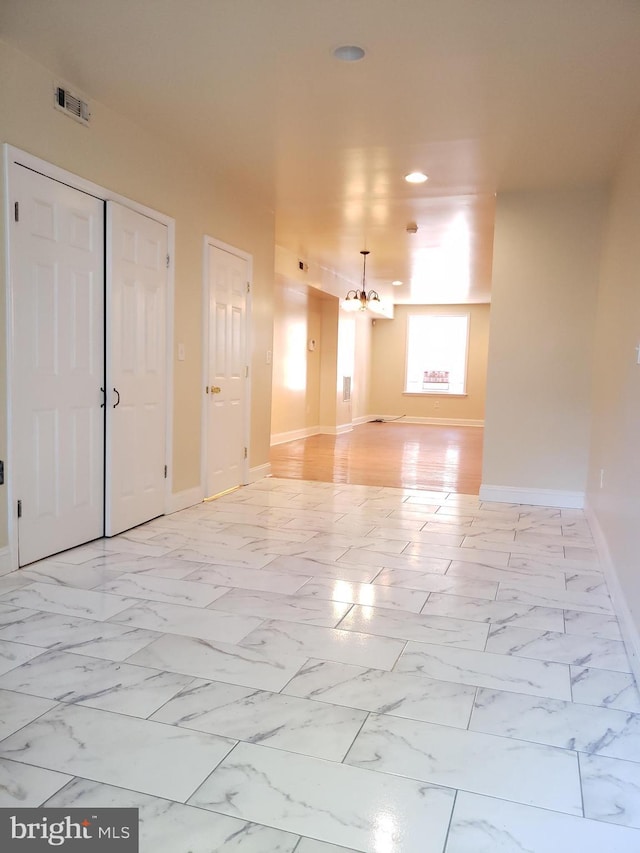 2615 N 12th St, Philadelphia, PA 19133 - empty room with recessed lighting, baseboards, marble finish floor, an inviting chandelier, and visible vents