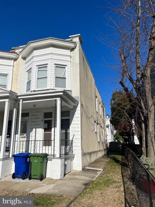 view of property exterior featuring a porch