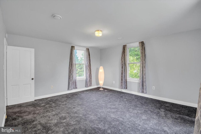 unfurnished room with carpet floors