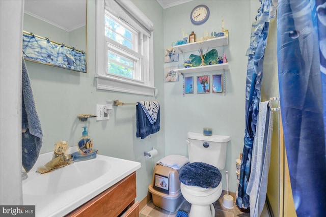 bathroom with vanity, tile floors, toilet, and ornamental molding