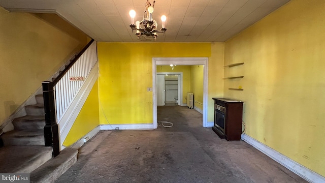 interior space featuring a chandelier and radiator heating unit