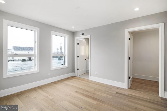 unfurnished bedroom with light hardwood / wood-style floors