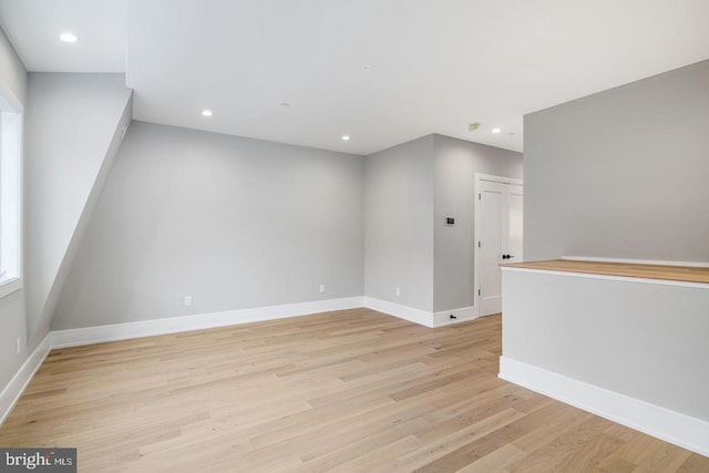 spare room with light hardwood / wood-style floors