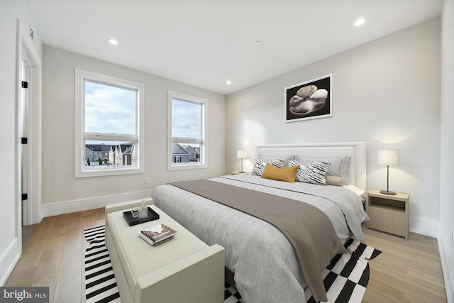 bedroom with light hardwood / wood-style floors