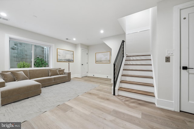 living room with light hardwood / wood-style flooring