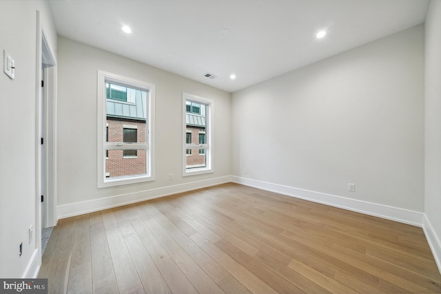 unfurnished room featuring light hardwood / wood-style flooring