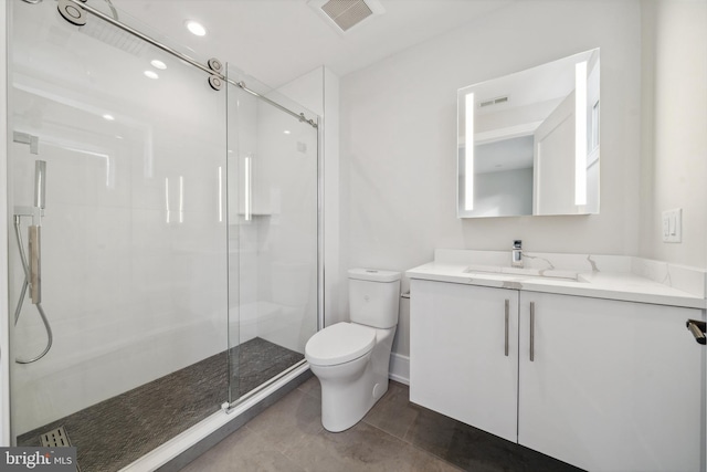 bathroom featuring toilet, tile floors, an enclosed shower, and vanity