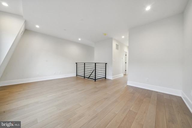 bonus room with light hardwood / wood-style floors