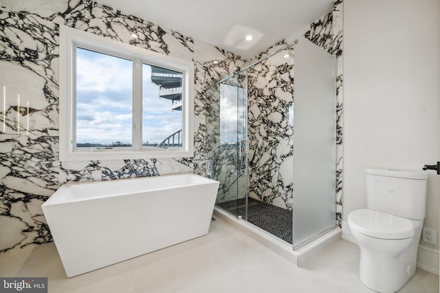 bathroom with toilet, tile flooring, and separate shower and tub