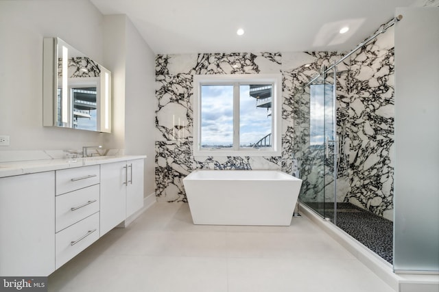 bathroom with vanity, tile floors, and independent shower and bath