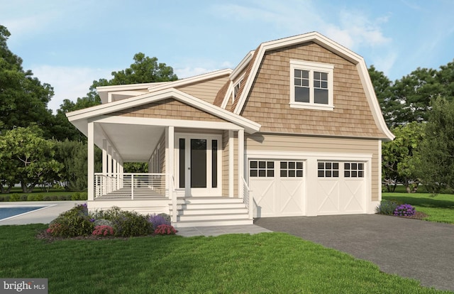 view of front of house featuring a front lawn, covered porch, and a garage