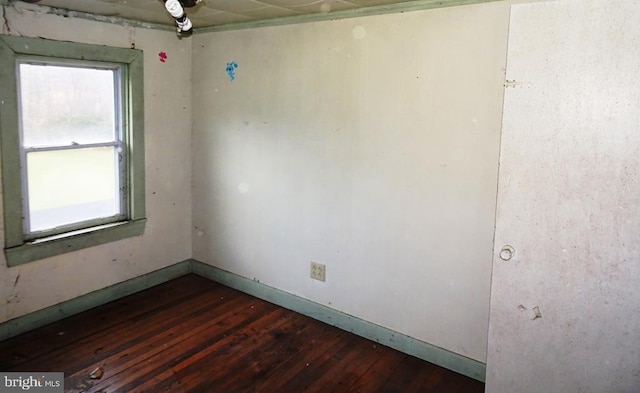 unfurnished room featuring dark hardwood / wood-style floors