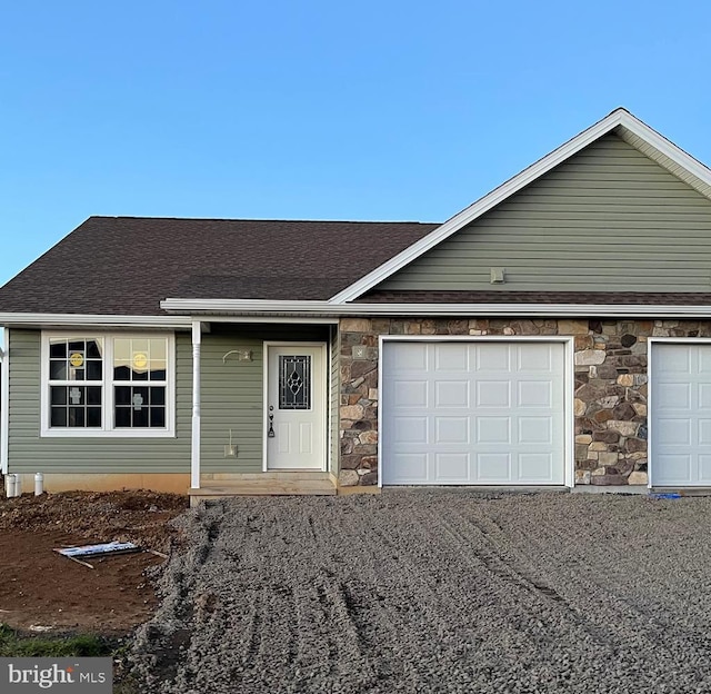 single story home featuring a garage