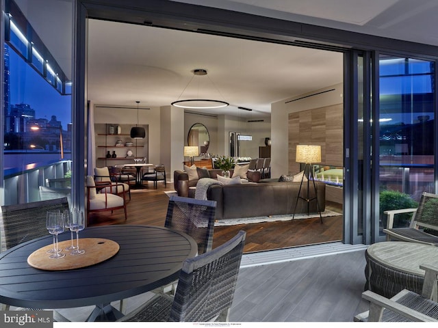 dining room with dark wood-type flooring