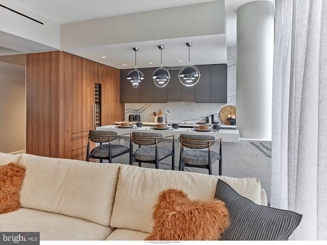 kitchen with hanging light fixtures and a kitchen bar