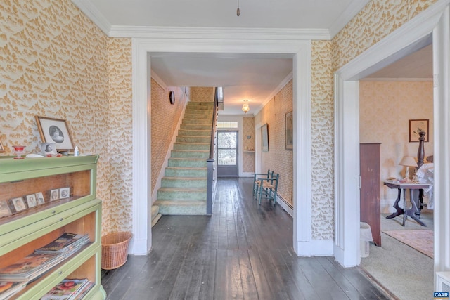 hallway with ornamental molding and dark hardwood / wood-style flooring