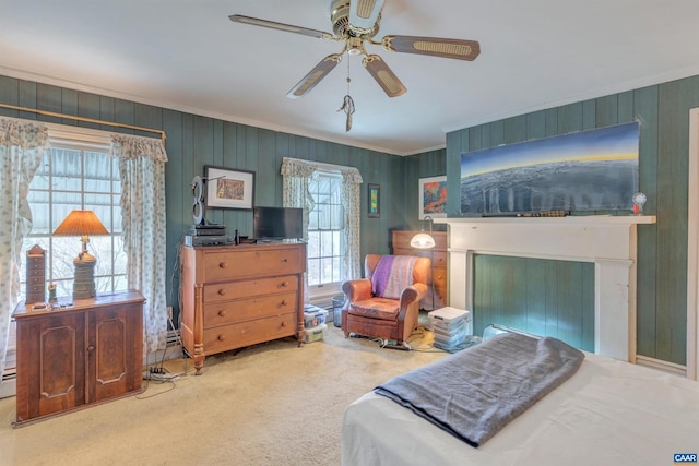 bedroom featuring wood walls, ceiling fan, carpet floors, and ornamental molding