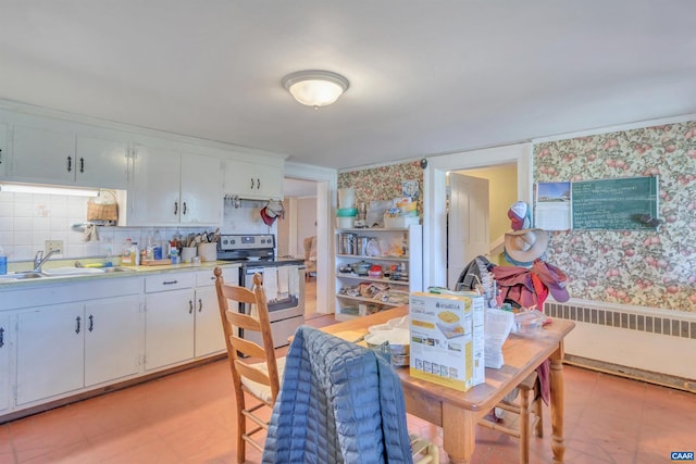 dining room featuring radiator and sink