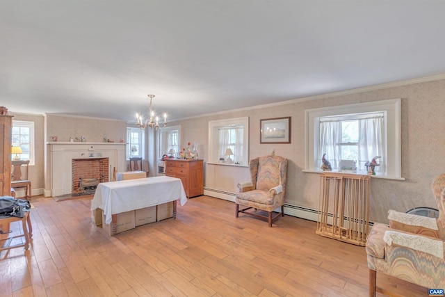 bedroom featuring light hardwood / wood-style floors, multiple windows, a baseboard heating unit, and an inviting chandelier