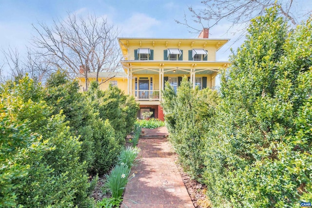 italianate-style house featuring covered porch