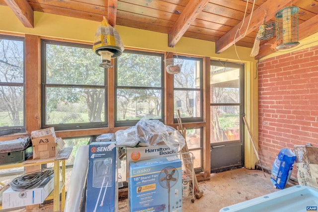 sunroom with a wealth of natural light, wood ceiling, and beamed ceiling