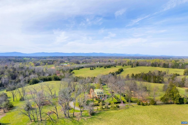 birds eye view of property with a mountain view and a rural view