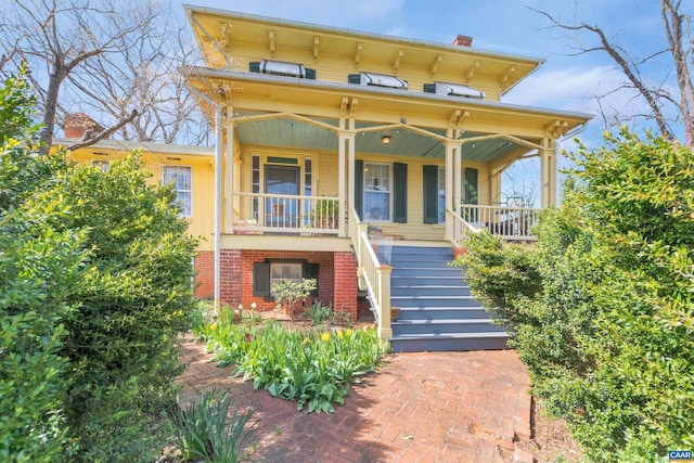 italianate-style house featuring covered porch