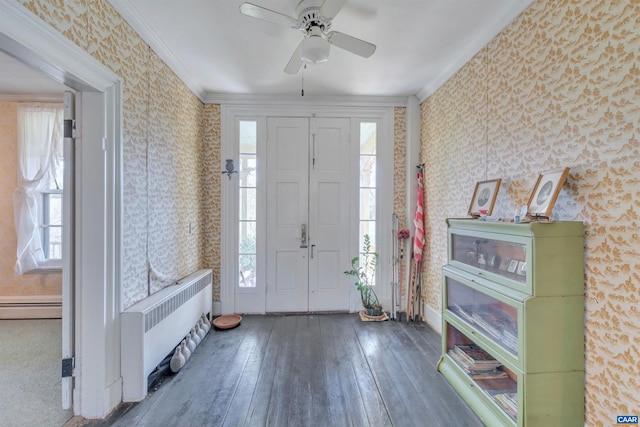 entrance foyer featuring ceiling fan, crown molding, and dark wood-type flooring