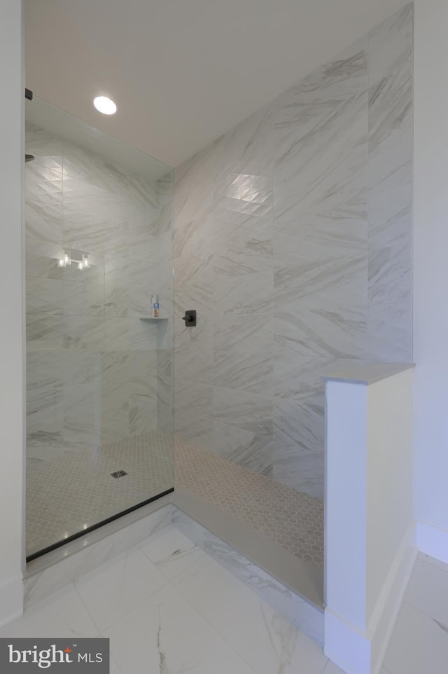 bathroom with tiled shower