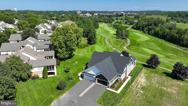 drone / aerial view with a residential view and golf course view