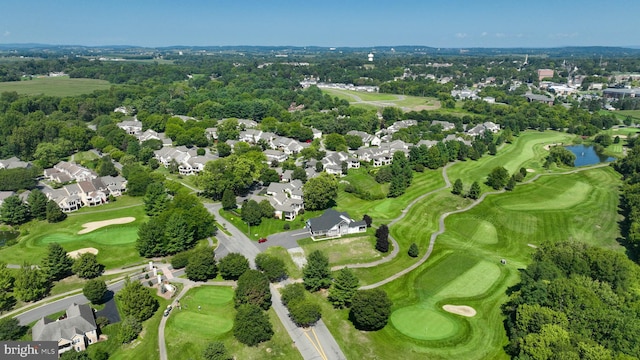 bird's eye view featuring golf course view, a water view, and a residential view