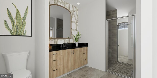 bathroom featuring vanity, toilet, and walk in shower