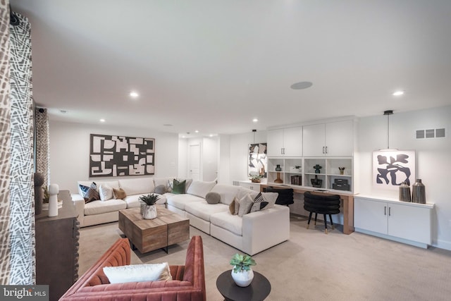 living room featuring light carpet